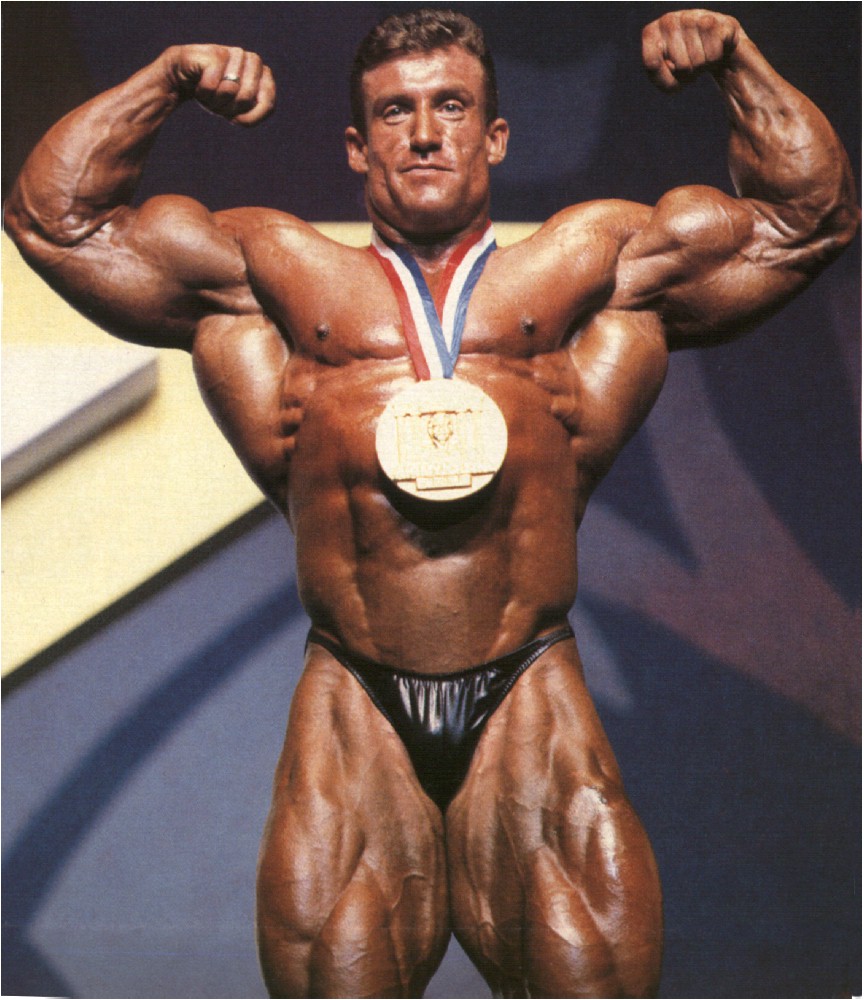 body builder dorian yates Mr. Olympia accepts medal award  flexing muscles